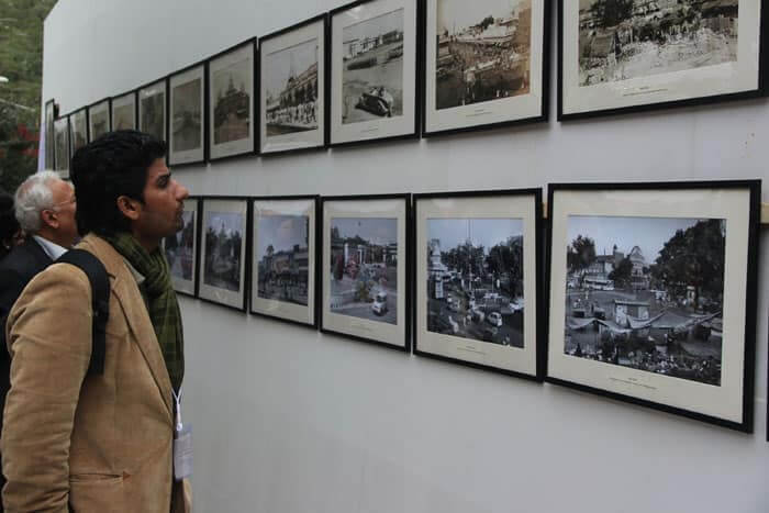 A visitor looks at the photo exhibition organized on the first day of the 7th Jaipur Literary festival.