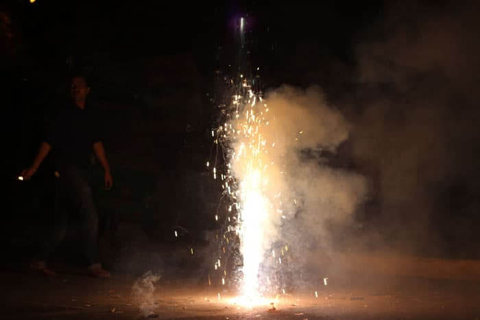A large firework sprays up into the air at a Diwali festivalays.